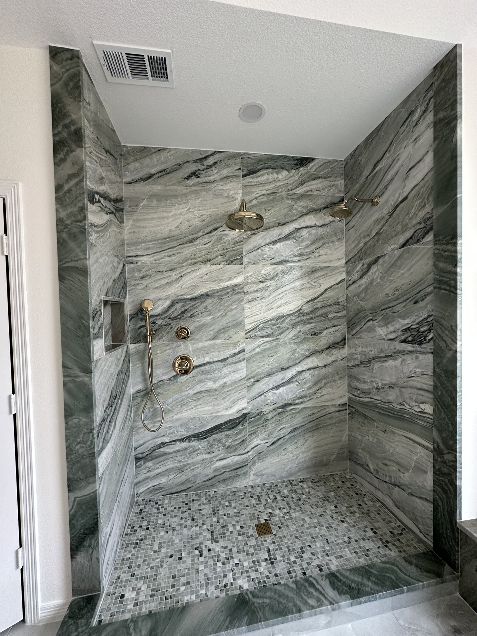 Premium marble tile shower installation by Cortes Remodeling