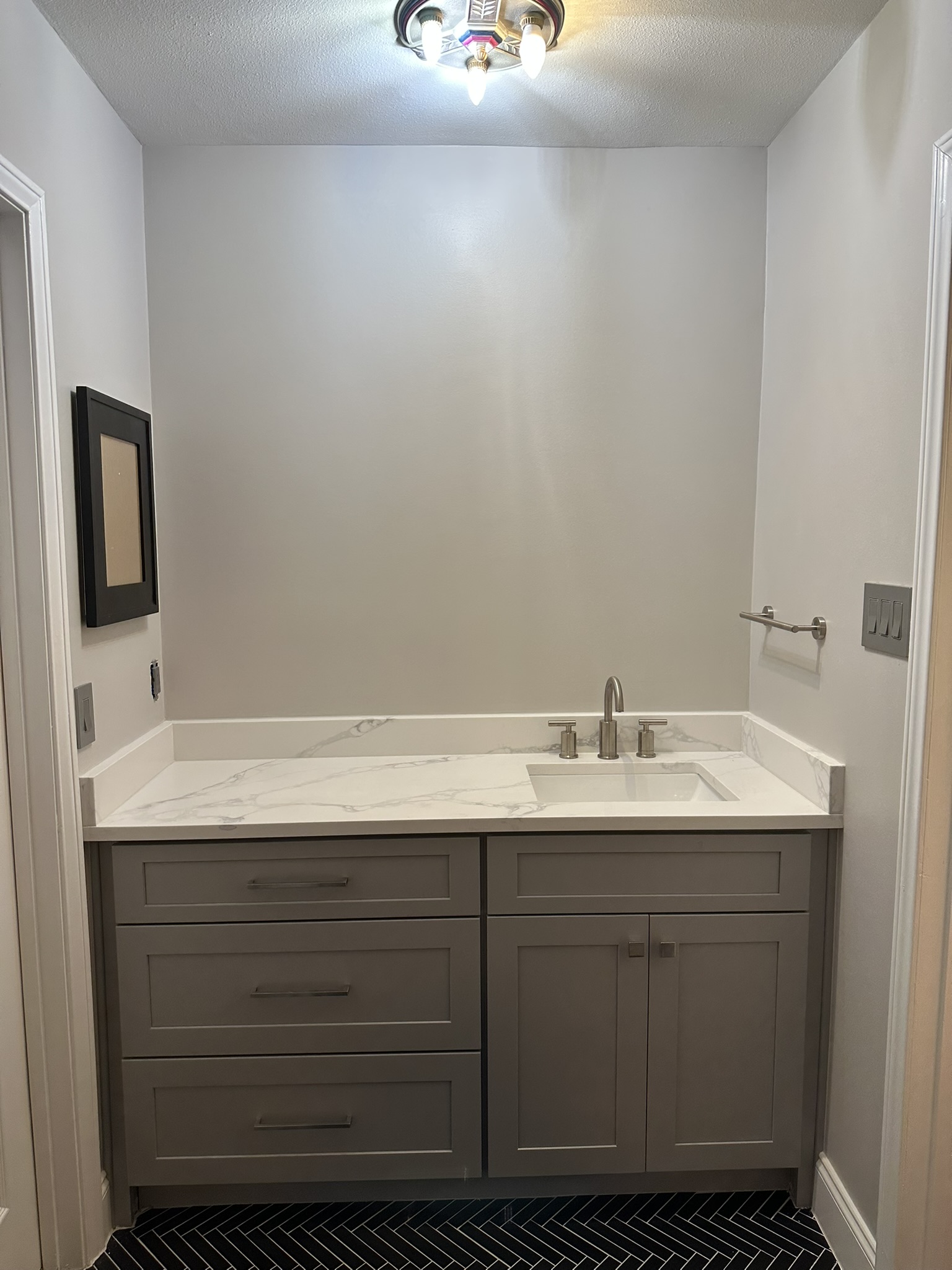 Grey shaker vanity with marble countertop